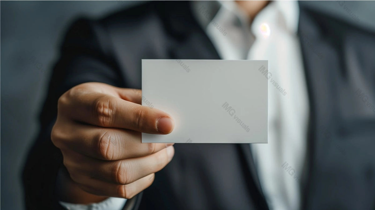 Businessman extends blank white card mockup towards camera, ai generated. Formal setting. Caucasian man with businesscard template advertising image. Professional mock up product photorealistic