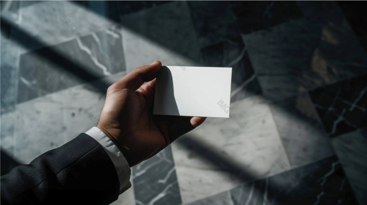 Suit hand holding business card mockup in sunlit marble-tiled setting, ai generated. Businesscard template advertising image. Elegance of personal branding. Professional mock up product photorealistic