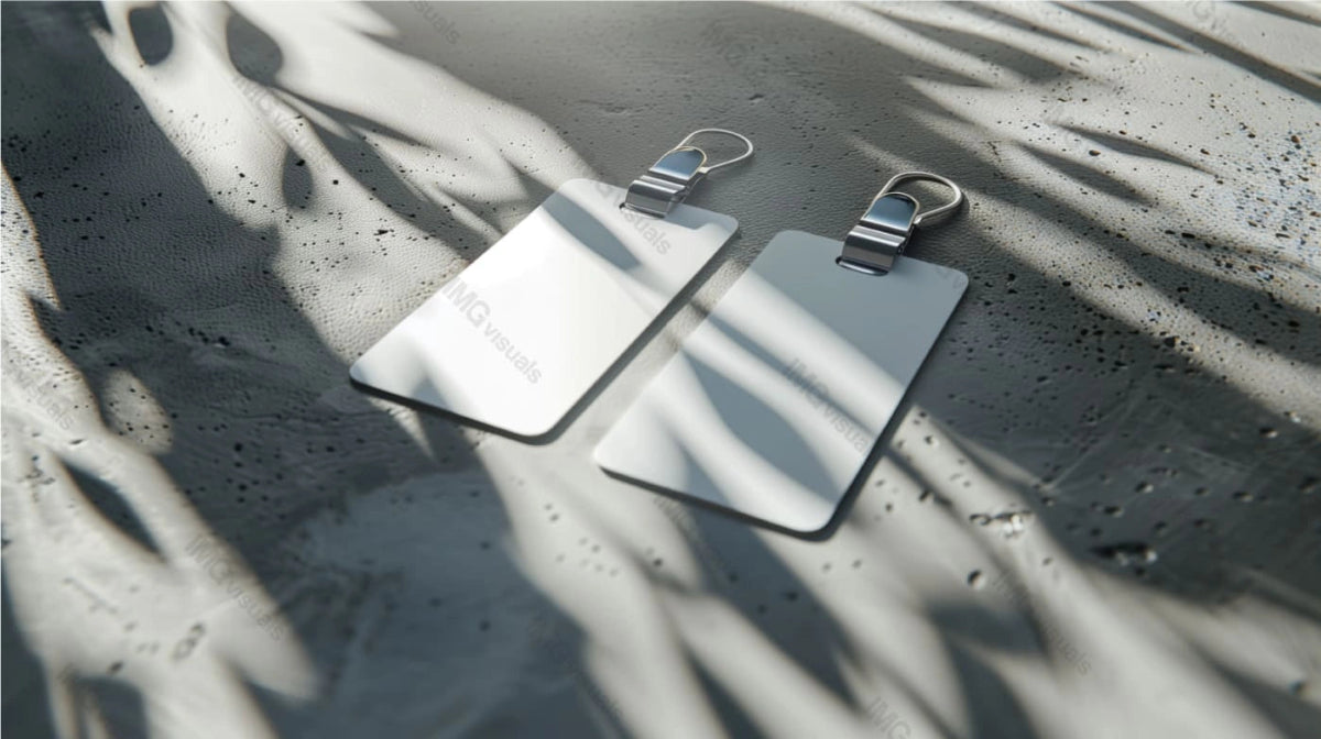 Two white id cards mockup with metal clips on textured surface in soft shadows, ai generated. Minimalistic template advertising image. Office identification accessory mock up product photorealistic